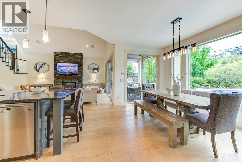 Spacious dining area opening to covered deck space. - 425 Audubon Court, Kelowna, BC - Indoor Photo Showing Dining Room