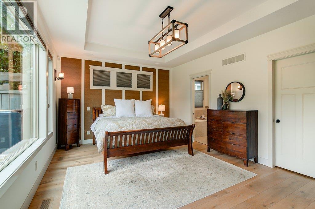 Main Level Primary bedroom - 425 Audubon Court, Kelowna, BC - Indoor Photo Showing Bedroom