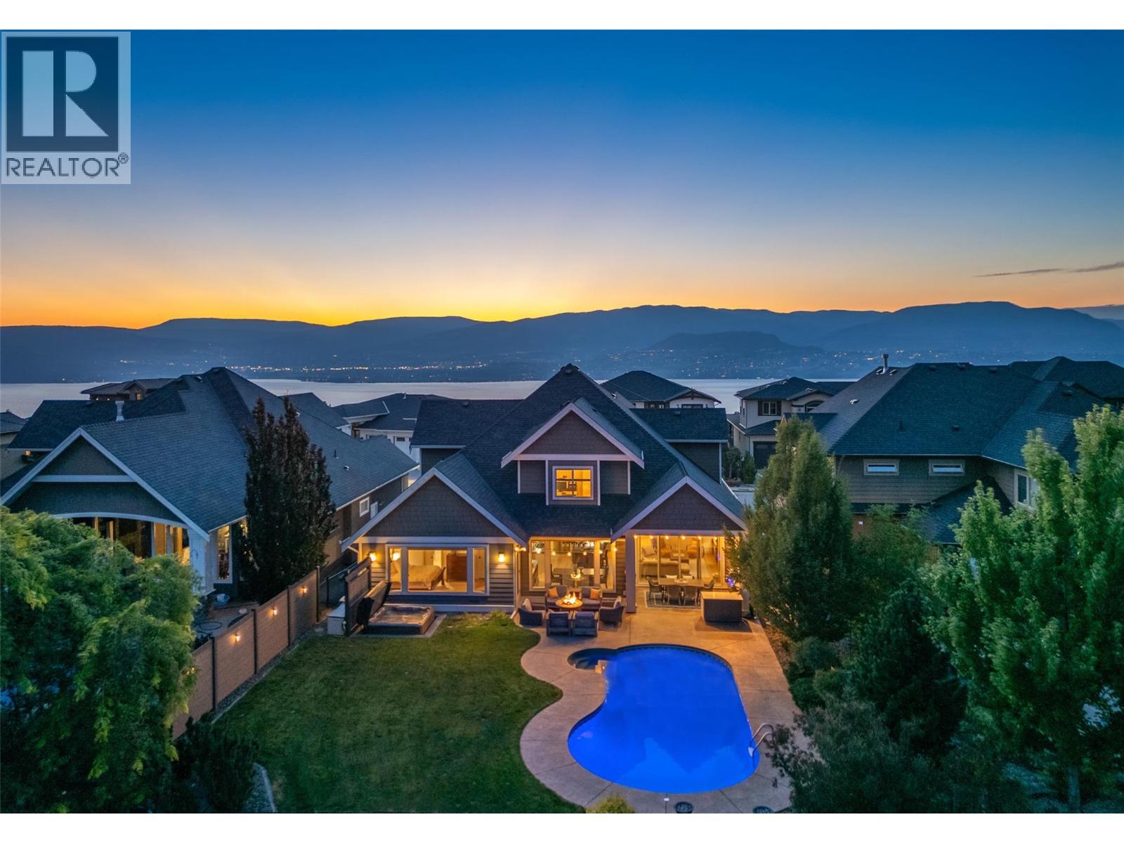 Amazing outdoor living overlooking protected parkland...pool, hot tub & covered lounge area. - 425 Audubon Court, Kelowna, BC - Outdoor With In Ground Pool With View