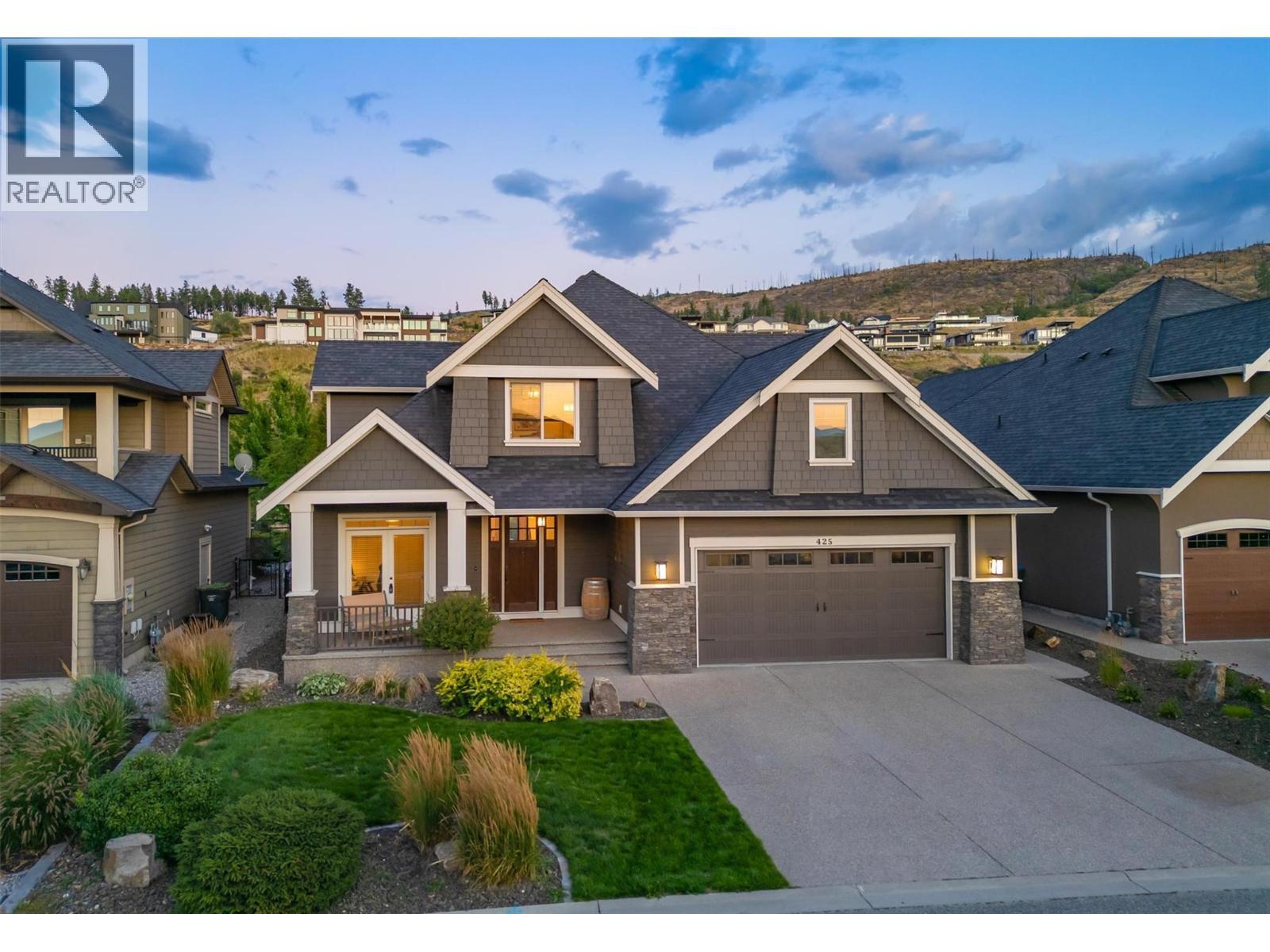 Lovely curb appeal with a beautiful entrance and quaint front porch - 425 Audubon Court, Kelowna, BC - Outdoor With Facade