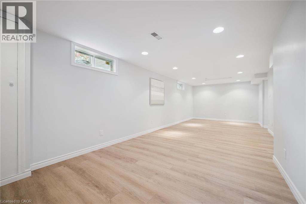 Below grade area featuring light wood-style floors and recessed lighting - 599 Beechwood Drive, Waterloo, ON - Indoor Photo Showing Other Room