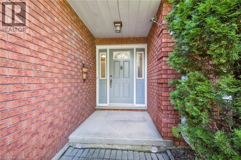 Property entrance featuring brick siding - 599 Beechwood Drive, Waterloo, ON - Outdoor With Exterior