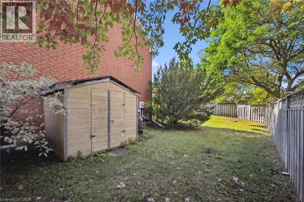 Fenced backyard with a storage shed - 599 Beechwood Drive, Waterloo, ON - Outdoor