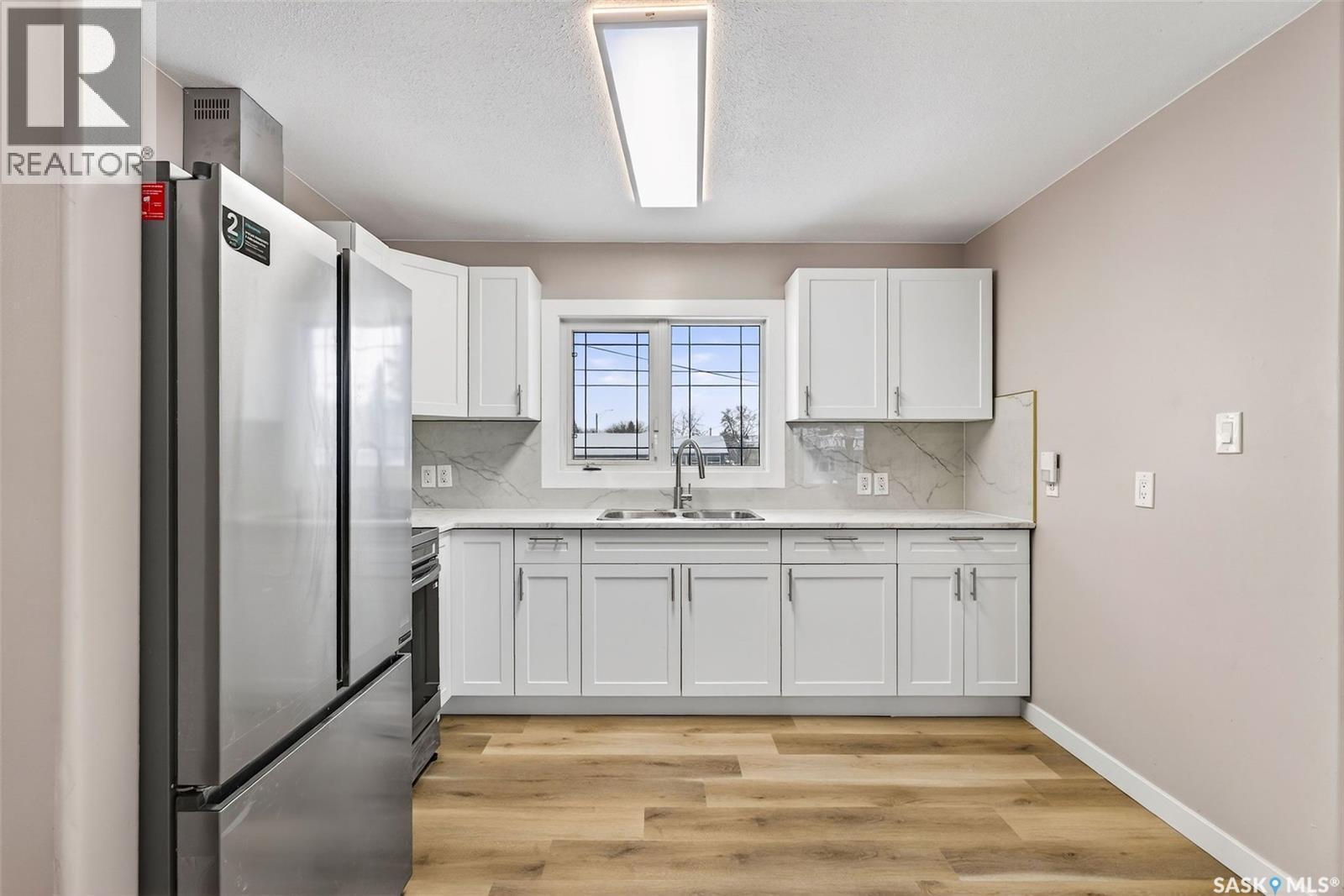 313 3Rd Avenue E, Shellbrook, SK - Indoor Photo Showing Kitchen With Double Sink