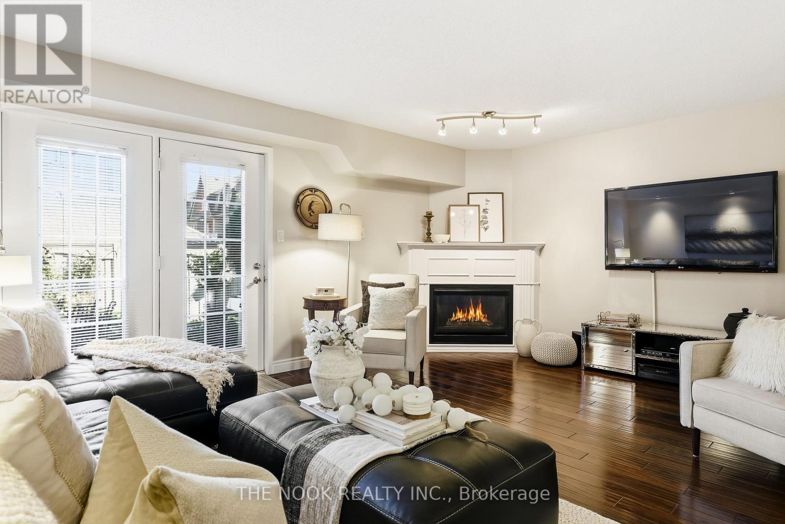102 - 1995 Royal Road, Pickering (Village East), ON - Indoor Photo Showing Living Room With Fireplace
