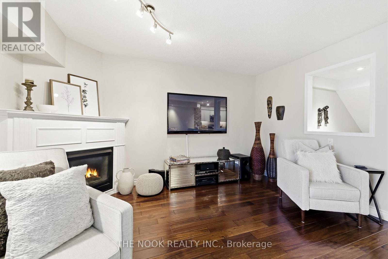 102 - 1995 Royal Road, Pickering (Village East), ON - Indoor Photo Showing Living Room With Fireplace