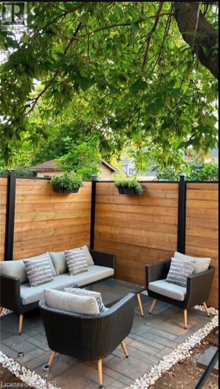 Deck with outdoor lounge area, a fenced backyard, and a patio area - 1024 Cannon Street E, Hamilton, ON - Outdoor With Deck Patio Veranda