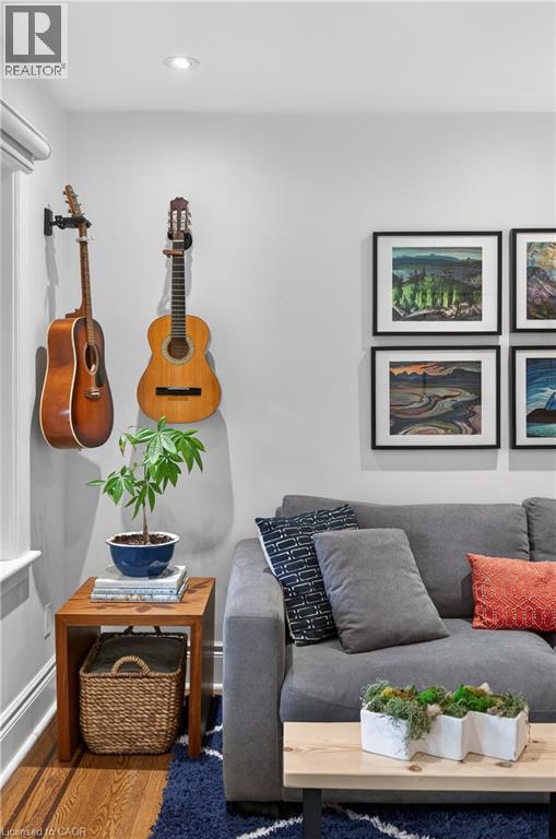 Detailed view of wood finished floors and recessed lighting - 248 London Street S, Hamilton, ON - Indoor