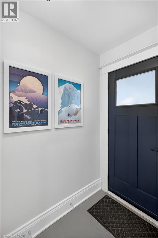 Entrance foyer featuring baseboards and tile patterned flooring - 248 London Street S, Hamilton, ON - Indoor Photo Showing Other Room