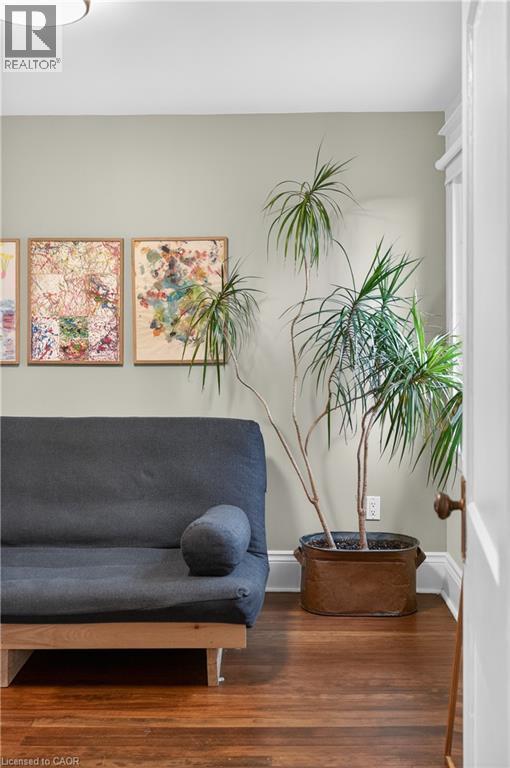 Sitting room featuring wood finished floors and baseboards - 248 London Street S, Hamilton, ON - Indoor