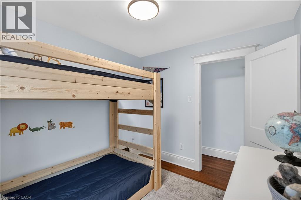 Bedroom featuring baseboards and light wood-style floors - 248 London Street S, Hamilton, ON - Indoor