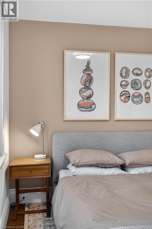 Bedroom featuring wood finished floors and baseboards - 248 London Street S, Hamilton, ON - Indoor Photo Showing Bedroom