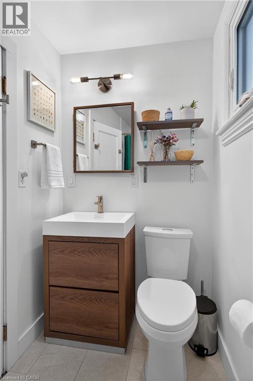 Bathroom with vanity and light tile patterned floors - 248 London Street S, Hamilton, ON - Indoor Photo Showing Bathroom