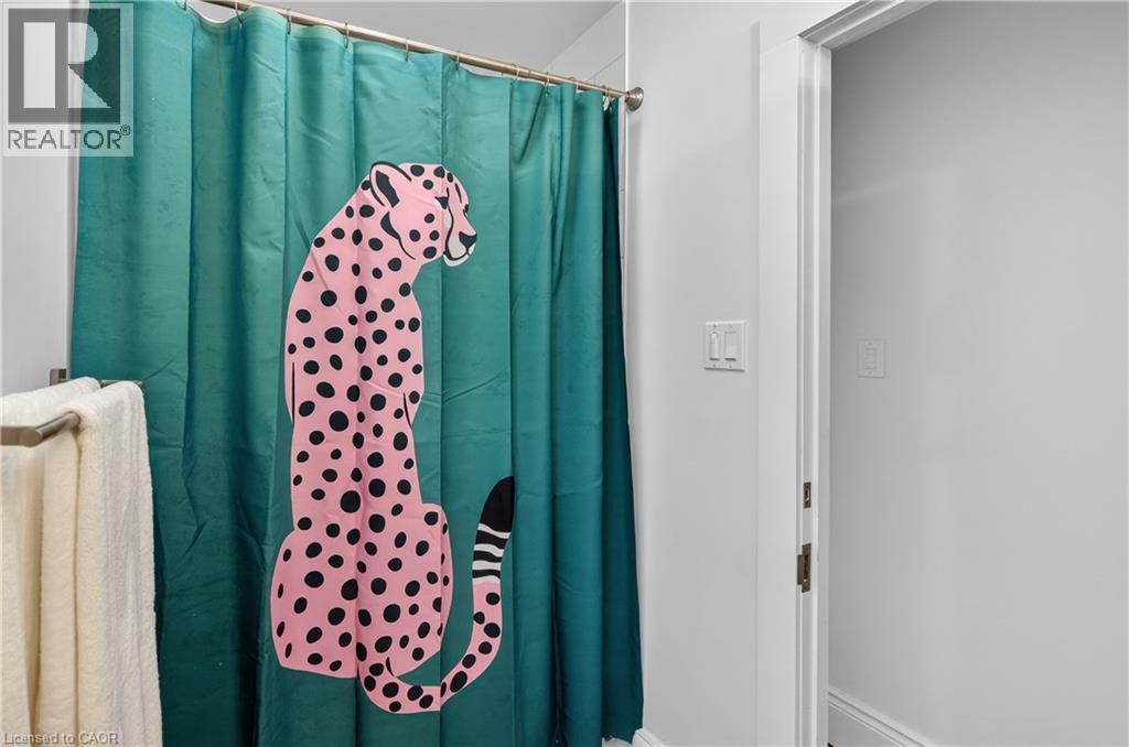 Bathroom with a shower with shower curtain - 248 London Street S, Hamilton, ON - Indoor Photo Showing Bathroom