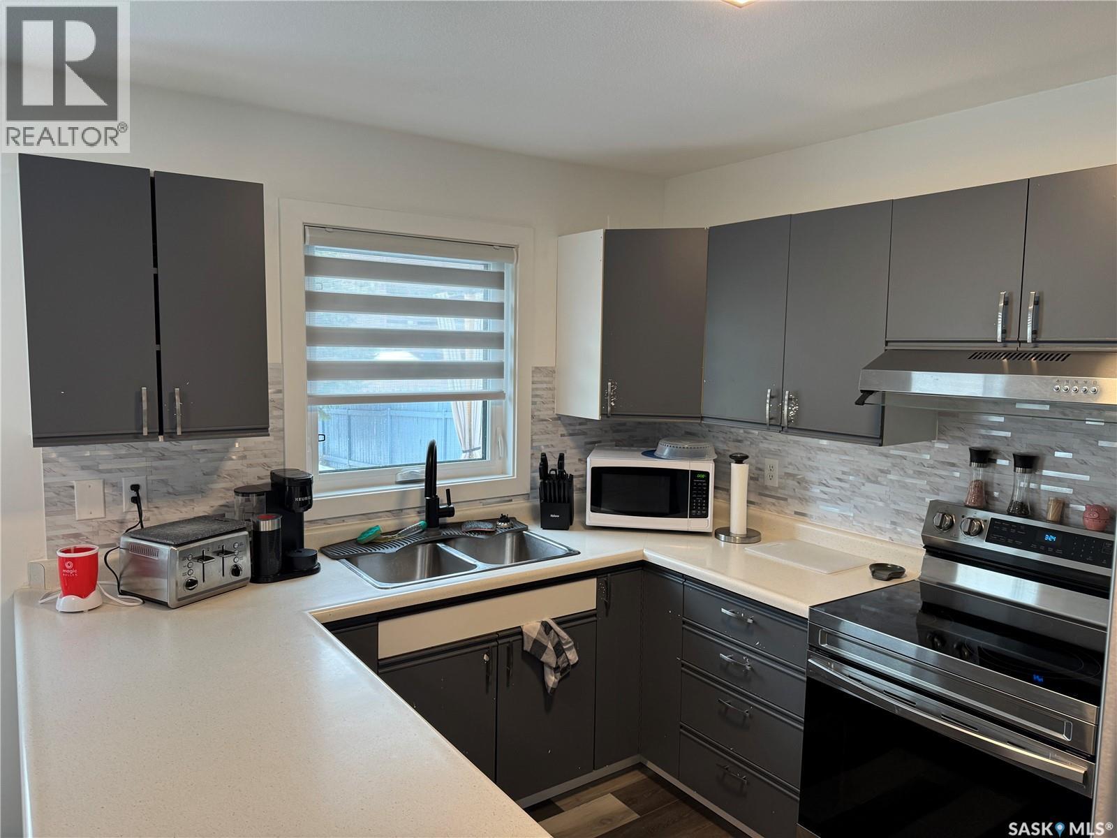 132 Barber Crescent, Saskatoon, SK - Indoor Photo Showing Kitchen With Double Sink