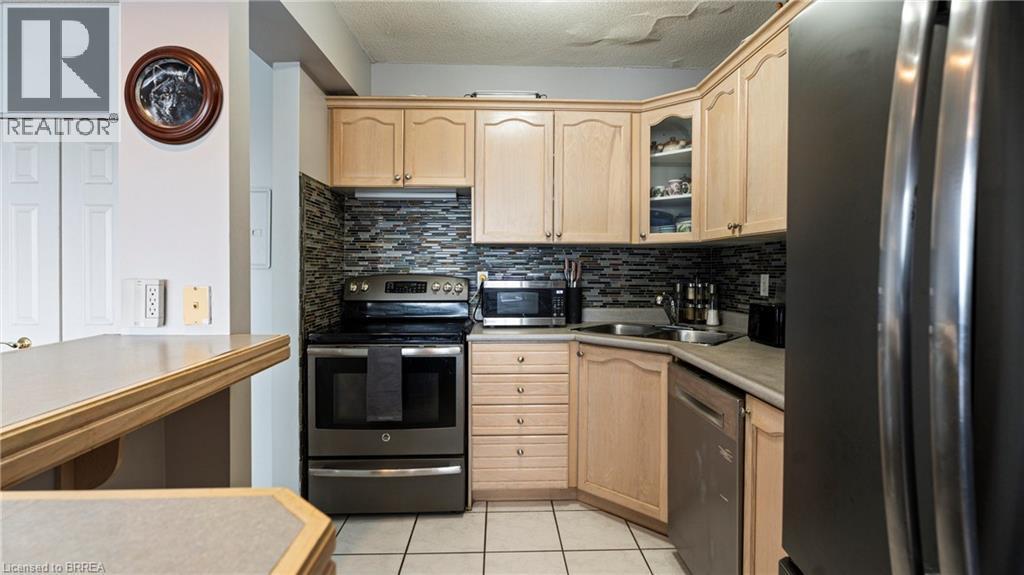 293 Mohawk Road E Unit# 501, Hamilton, ON - Indoor Photo Showing Kitchen With Double Sink