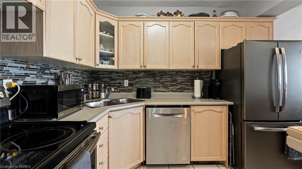 293 Mohawk Road E Unit# 501, Hamilton, ON - Indoor Photo Showing Kitchen With Double Sink