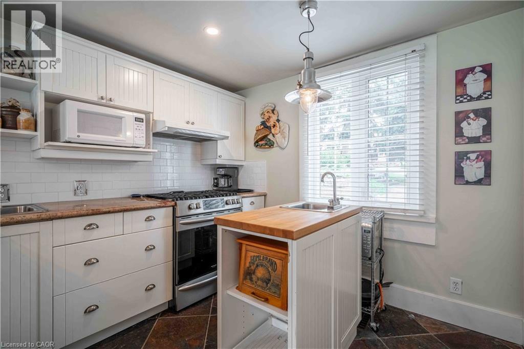 Functional kitchen area with second sink in island. - 99 Argyle Street N, Caledonia, ON - Indoor Photo Showing Kitchen