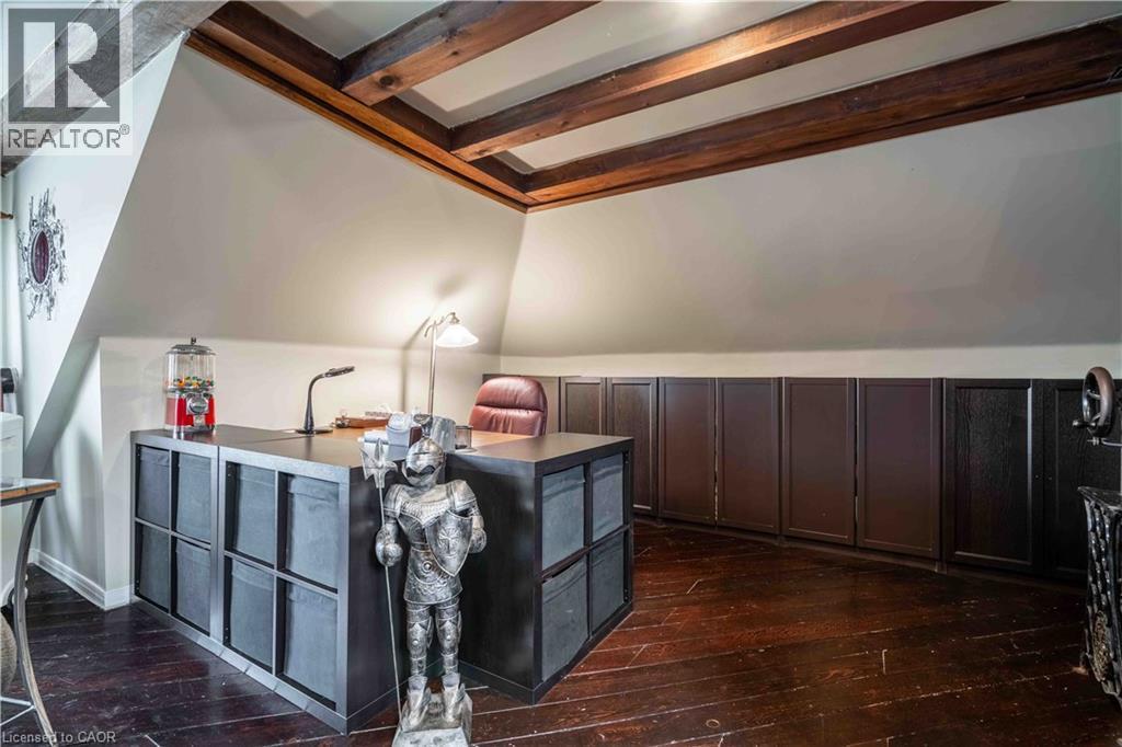 Third level Family Room with decor beamed ceiling accents - 99 Argyle Street N, Caledonia, ON - Indoor Photo Showing Other Room