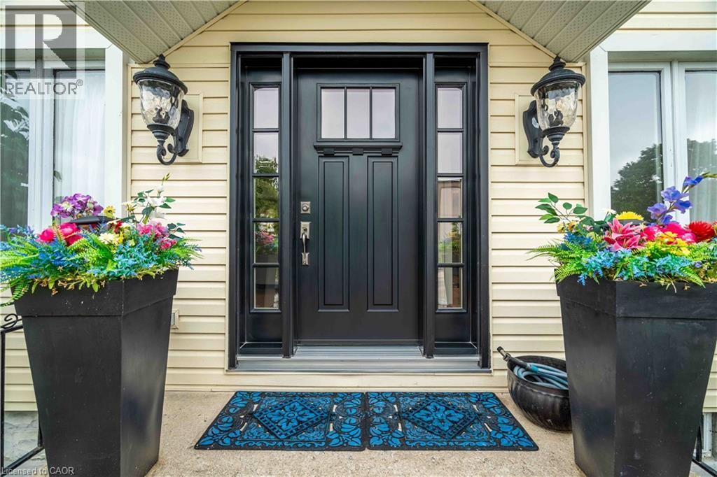Shiny new Entry door with accenting sidelights. - 99 Argyle Street N, Caledonia, ON - Outdoor With Exterior