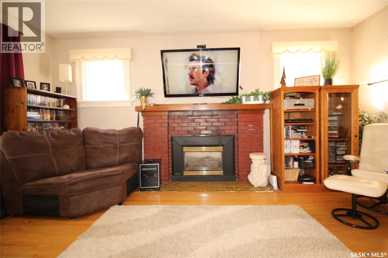663 2Nd Street E, Shaunavon, SK - Indoor Photo Showing Living Room With Fireplace