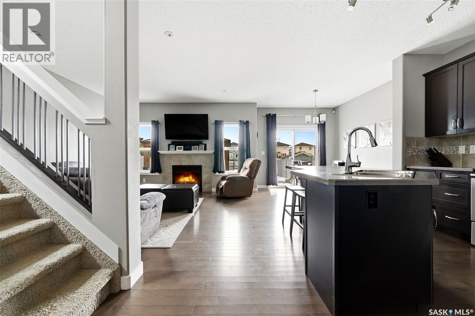 5343 Universal Crescent, Regina, SK - Indoor Photo Showing Kitchen With Fireplace With Double Sink
