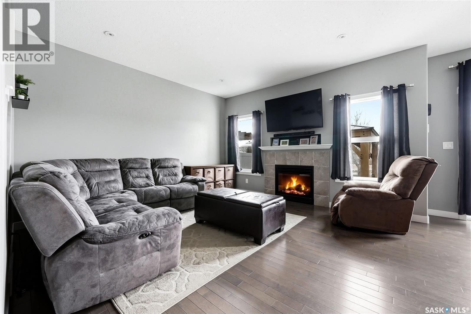 5343 Universal Crescent, Regina, SK - Indoor Photo Showing Living Room With Fireplace