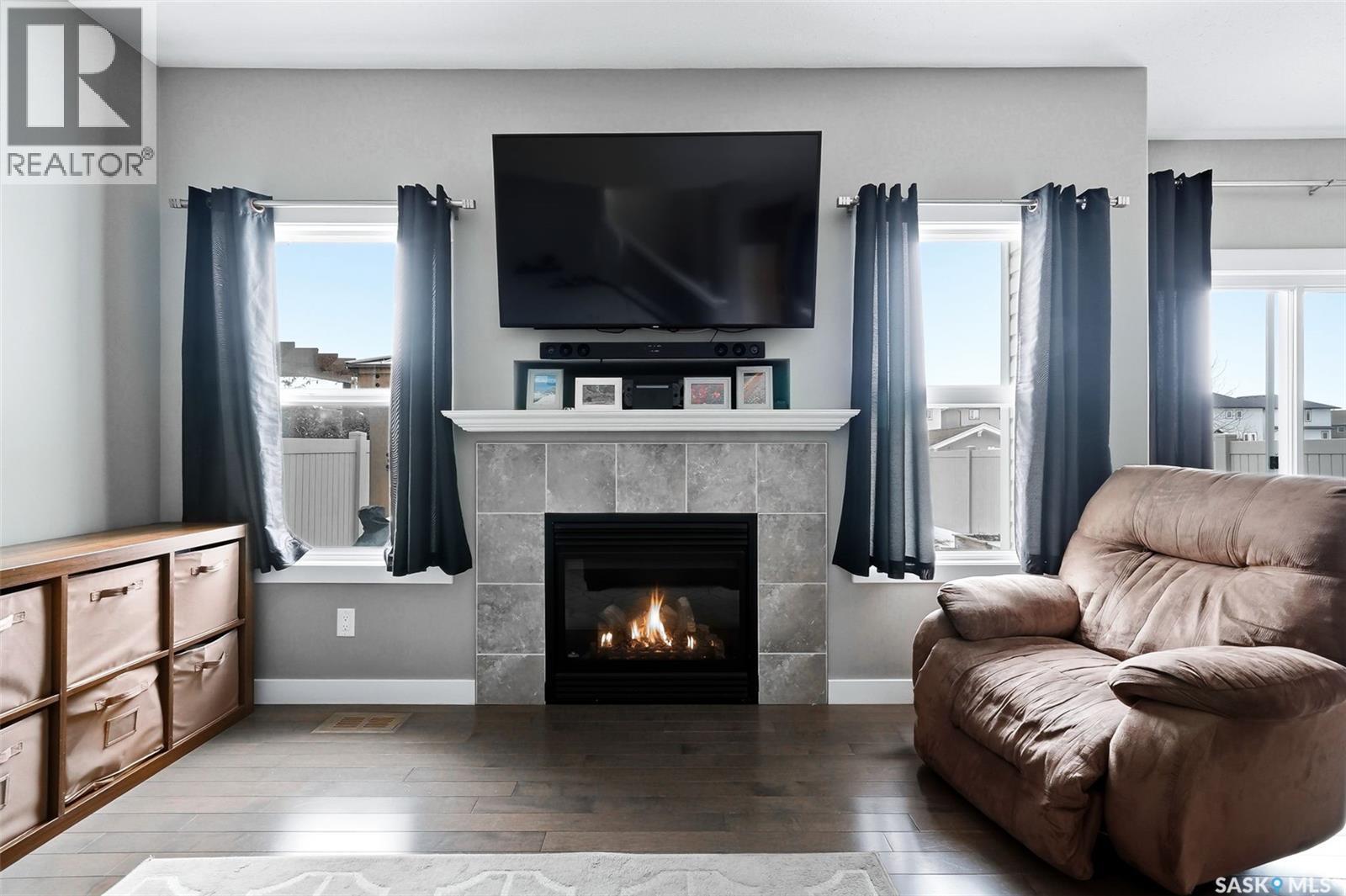 5343 Universal Crescent, Regina, SK - Indoor Photo Showing Living Room With Fireplace