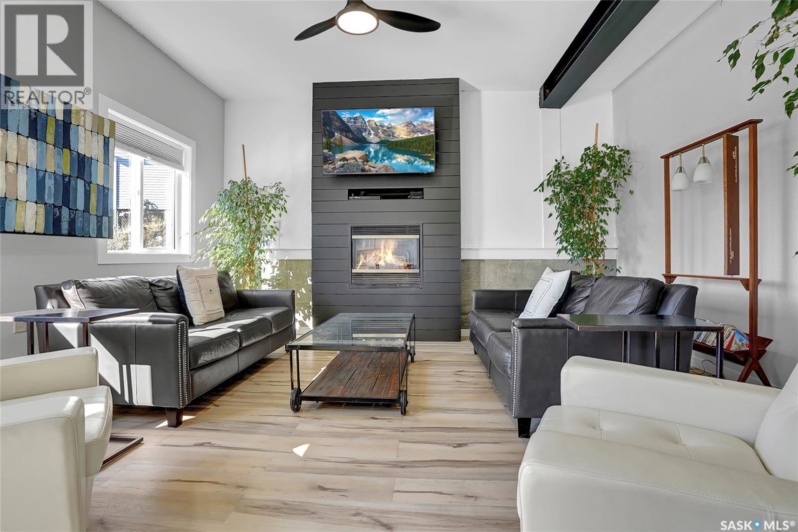 26 Alice Crescent, North Grove, SK - Indoor Photo Showing Living Room With Fireplace