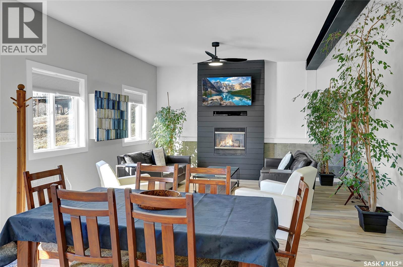 26 Alice Crescent, North Grove, SK - Indoor Photo Showing Dining Room With Fireplace