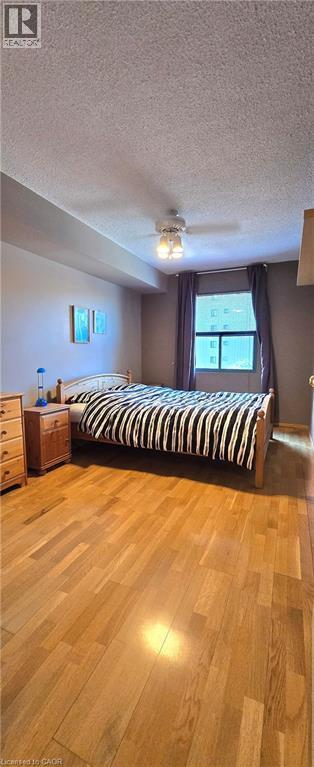 Primary Bedroom w/ Walk-in Closet - 175 E Hunter Street E Unit# 404, Hamilton, ON - Indoor Photo Showing Bedroom