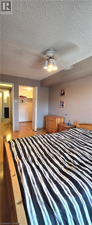 Primary Bedroom w/ Walk-in Closet - 175 E Hunter Street E Unit# 404, Hamilton, ON - Indoor Photo Showing Bedroom