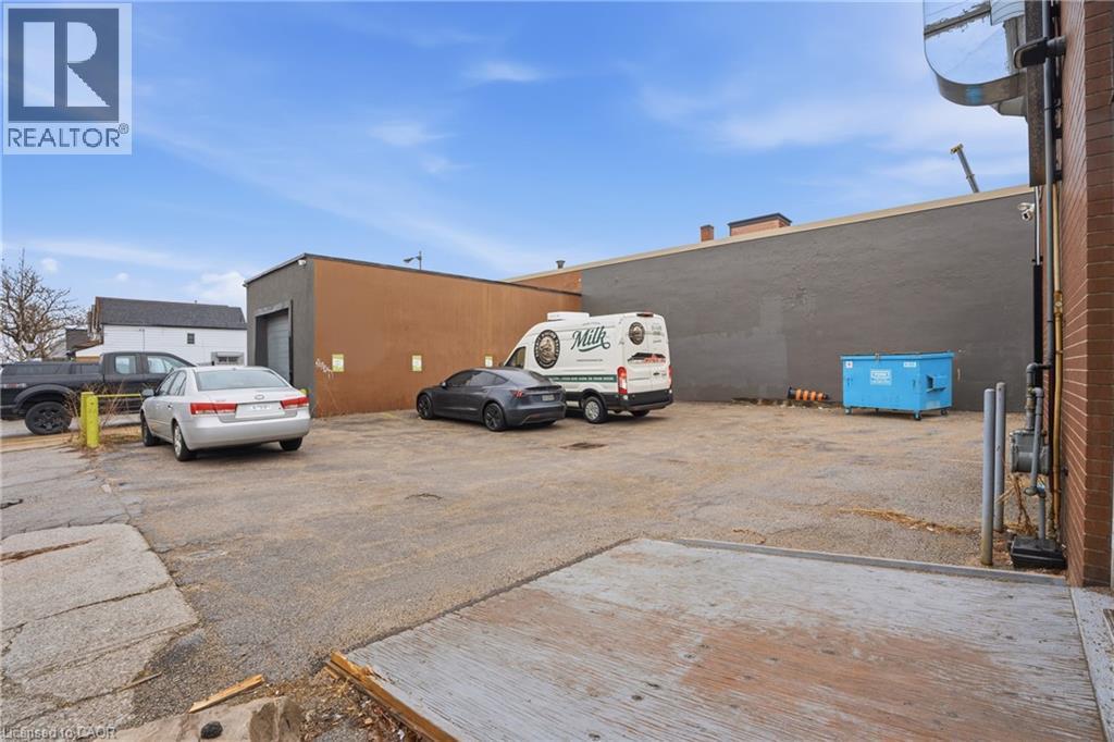 View of uncovered parking lot - 204 Ottawa Street N, Hamilton, ON