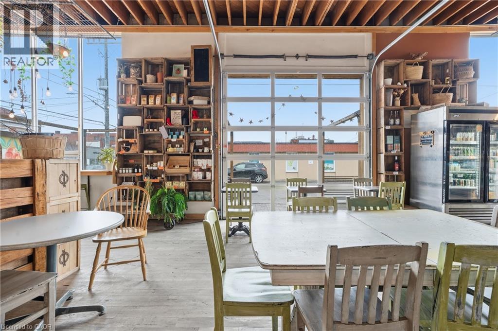 Dining area featuring wood finished floors - 204 Ottawa Street N, Hamilton, ON