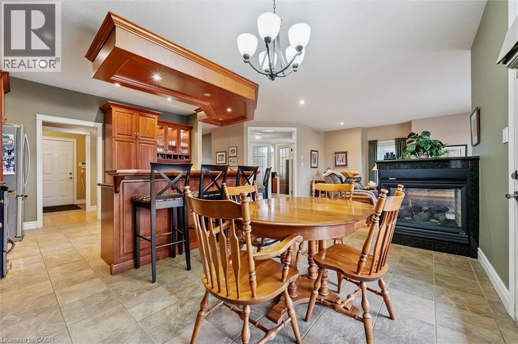 285 Deer Ridge Drive, Kitchener, ON - Indoor Photo Showing Dining Room With Fireplace