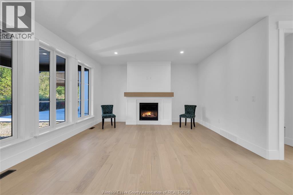 7355 Garnet, Mcgregor, ON - Indoor Photo Showing Other Room With Fireplace