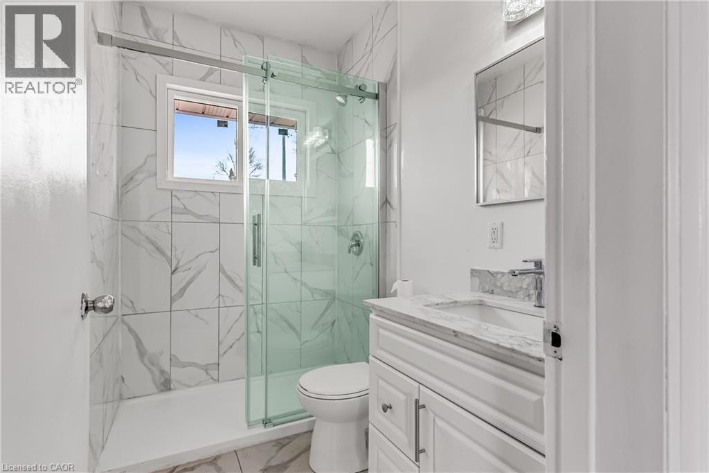 Full bathroom with a marble finish shower, vanity, and light marble finish floors - 41 Floral Crescent, Kitchener, ON - Indoor Photo Showing Bathroom