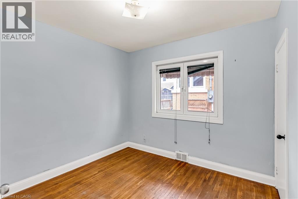 Unfurnished room with baseboards and hardwood / wood-style floors - 41 Floral Crescent, Kitchener, ON - Indoor Photo Showing Other Room