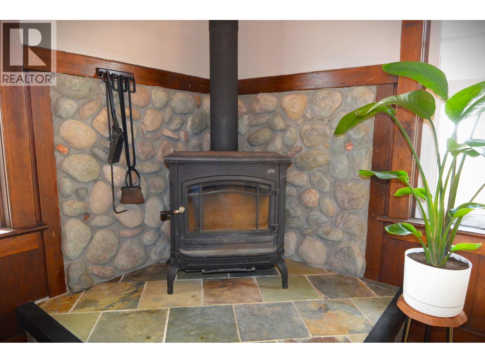 3875 Second Avenue, Smithers, BC - Indoor Photo Showing Living Room With Fireplace