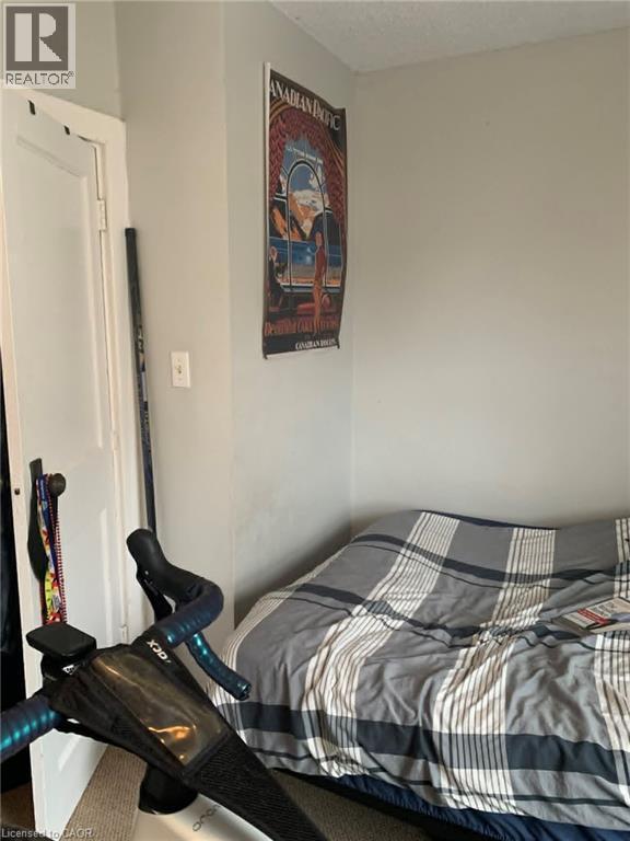 Bedroom featuring a textured ceiling - 9 Waterloo Avenue, Guelph, ON - Indoor Photo Showing Bedroom