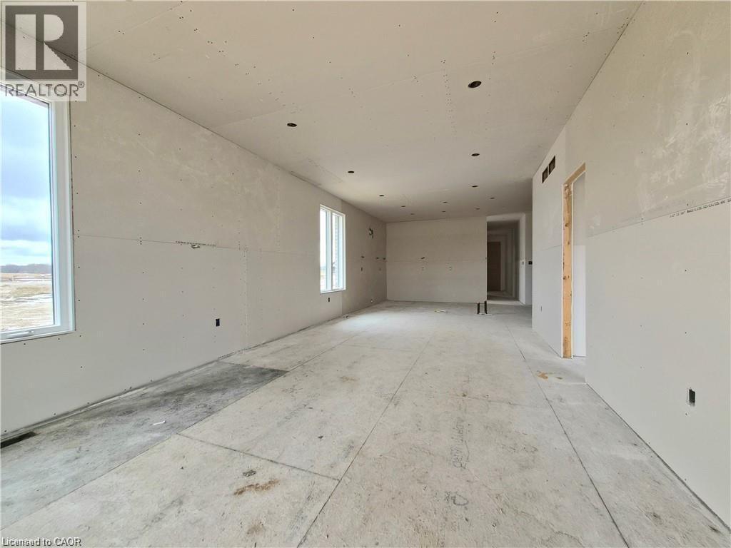 View of empty room - 106 Thackeray Way, Harriston, ON - Indoor Photo Showing Other Room
