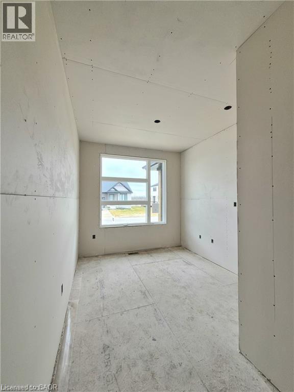 View of empty room - 106 Thackeray Way, Harriston, ON - Indoor Photo Showing Other Room