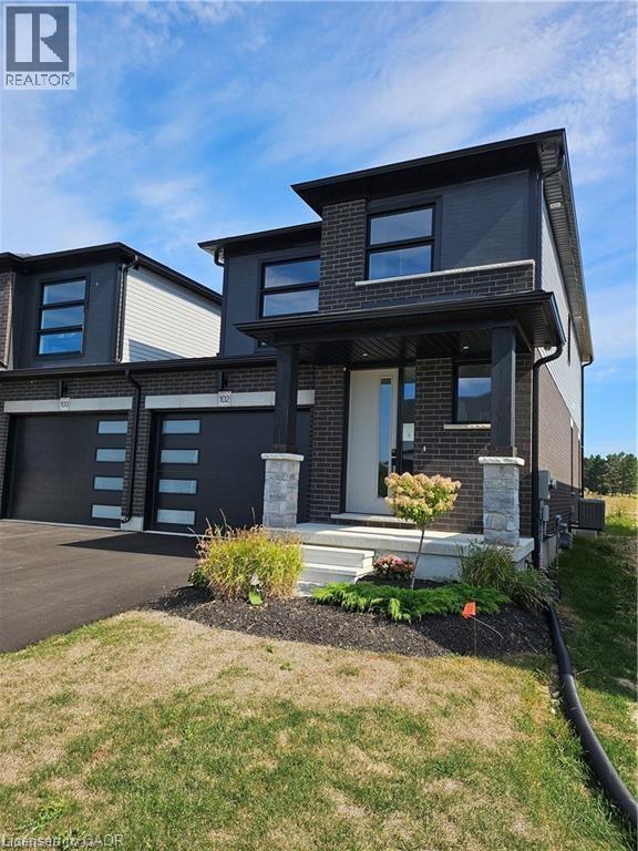 102 Thackeray Way, Harriston, ON - Outdoor With Facade