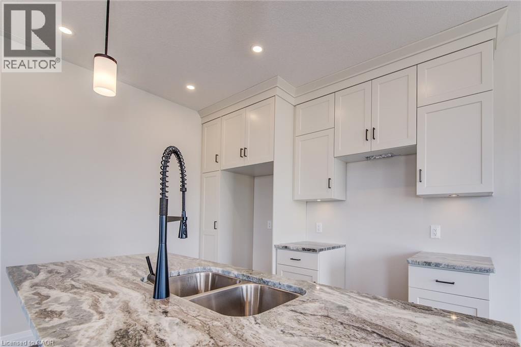 102 Thackeray Way, Harriston, ON - Indoor Photo Showing Kitchen With Double Sink