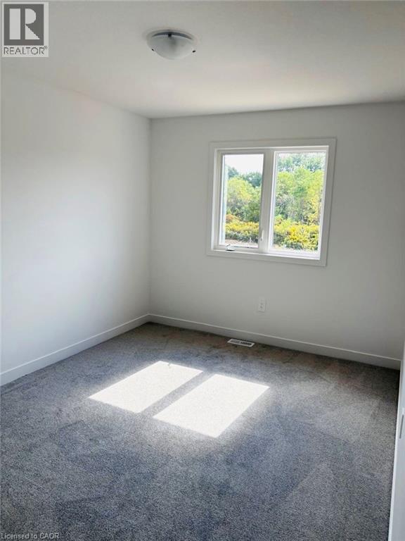 Unfurnished room featuring carpet floors - 7 Pin Oak Common, Cambridge, ON - Indoor Photo Showing Other Room