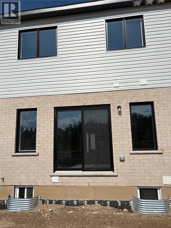 View of side of home featuring brick siding - 7 Pin Oak Common, Cambridge, ON - With Exterior