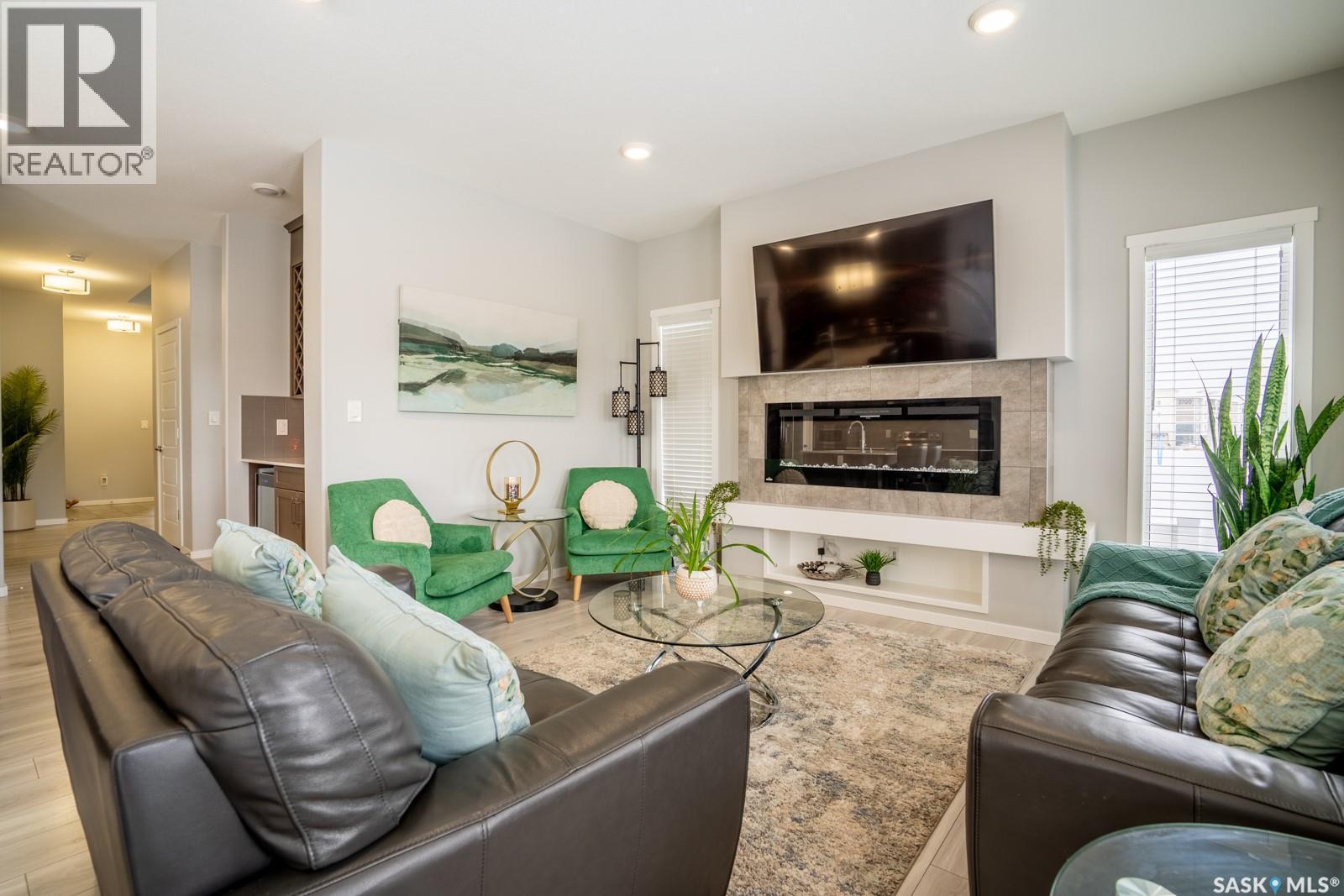 5144 Green Crescent E, Regina, SK - Indoor Photo Showing Living Room With Fireplace