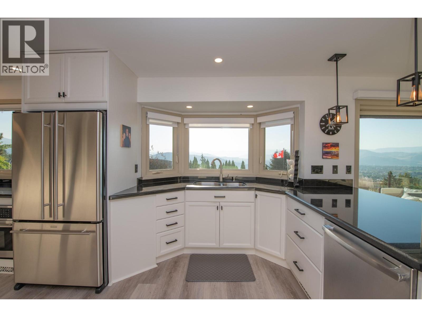 Gorgeous views from here - 702 Cypress Drive, Coldstream, BC - Indoor Photo Showing Kitchen With Double Sink