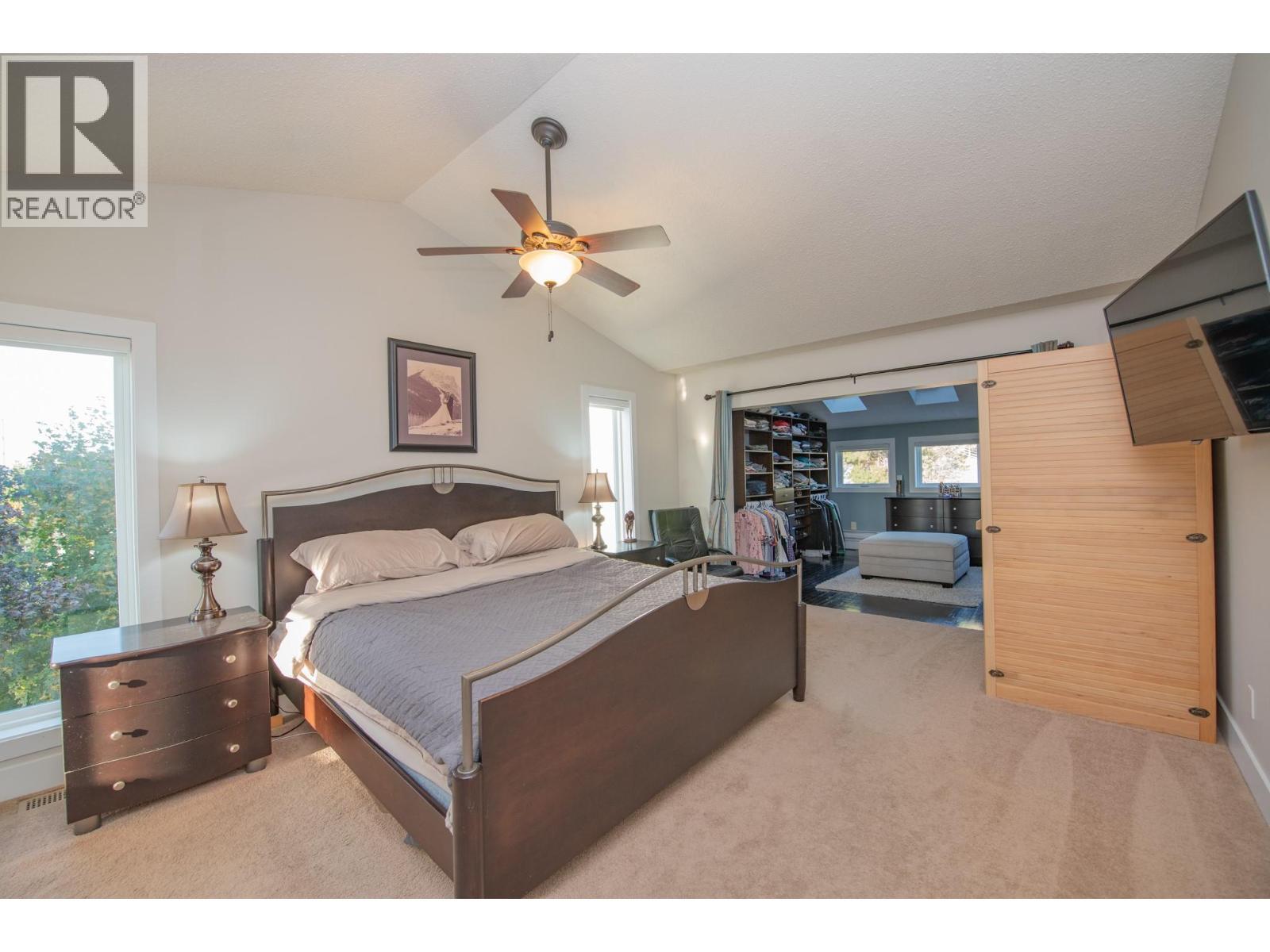 Master Bedroom (1 of 4 bedrooms upstairs) - 702 Cypress Drive, Coldstream, BC - Indoor Photo Showing Bedroom