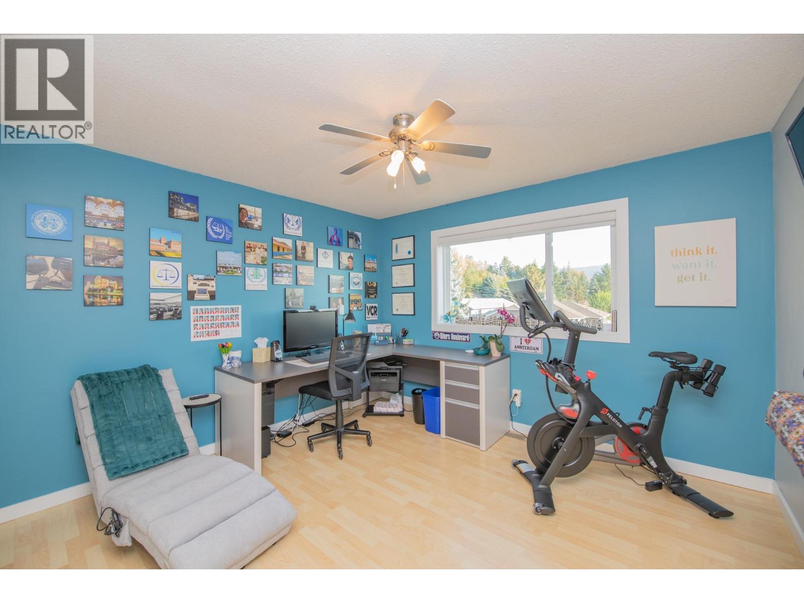 2 of 4 bedrooms upstairs, currently used as office - 702 Cypress Drive, Coldstream, BC - Indoor Photo Showing Gym Room